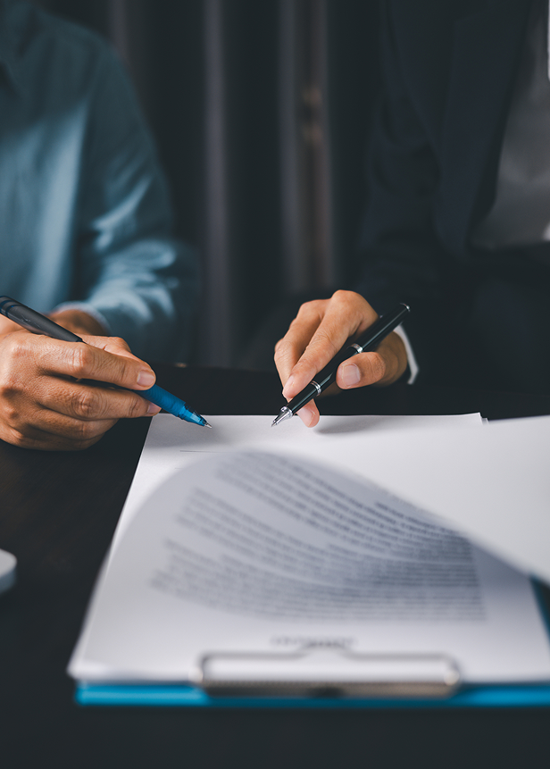 Two people reviewing a contract