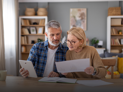 Elderly couple reviewing documents together
